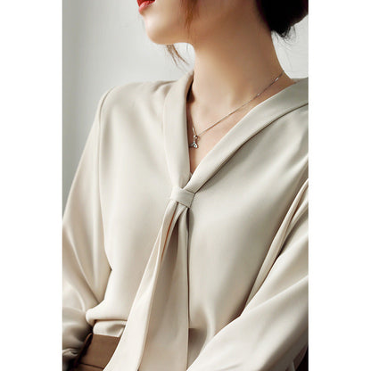 Women's chiffon blouse with elegant bow tie neck, soft V-cut drape, lightweight flowy fabric, formal style
