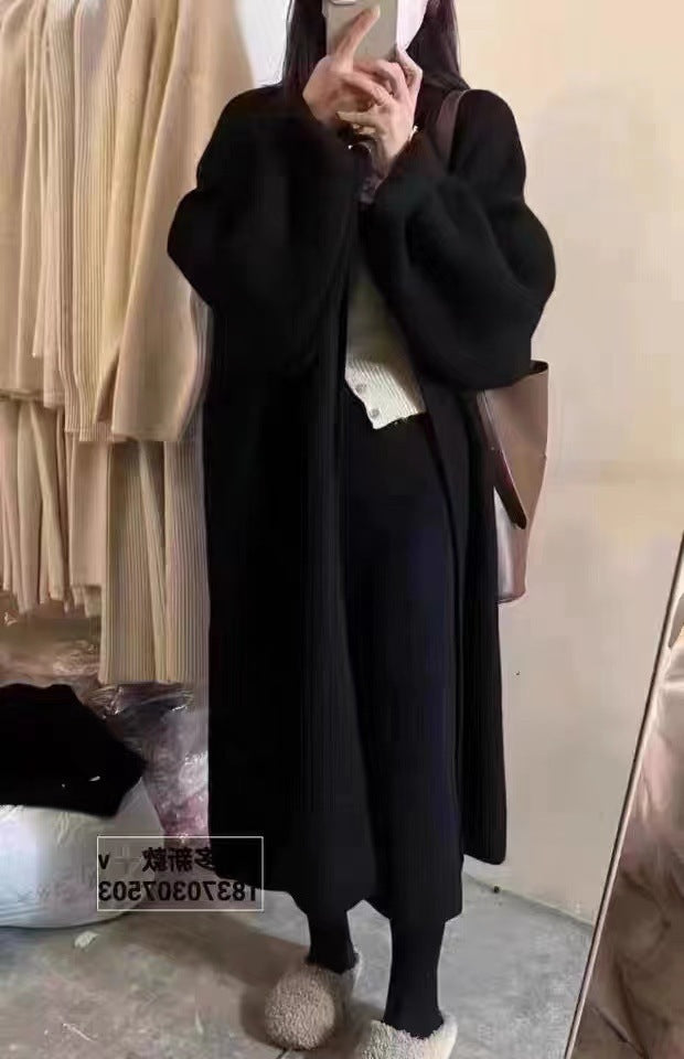 Women's oversized wool knit cardigan coat with draped open front in full-length luxe silhouette