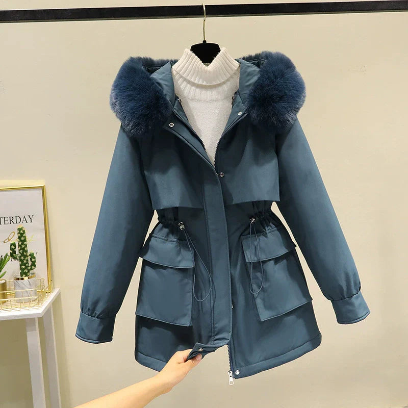 Women's tailored fit parka jacket with faux fur hood, quilted lining, zip front winter coat