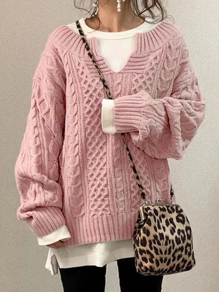 Elegant wool knit sweater in neutral tone, classic relaxed fit with refined textured knit detail