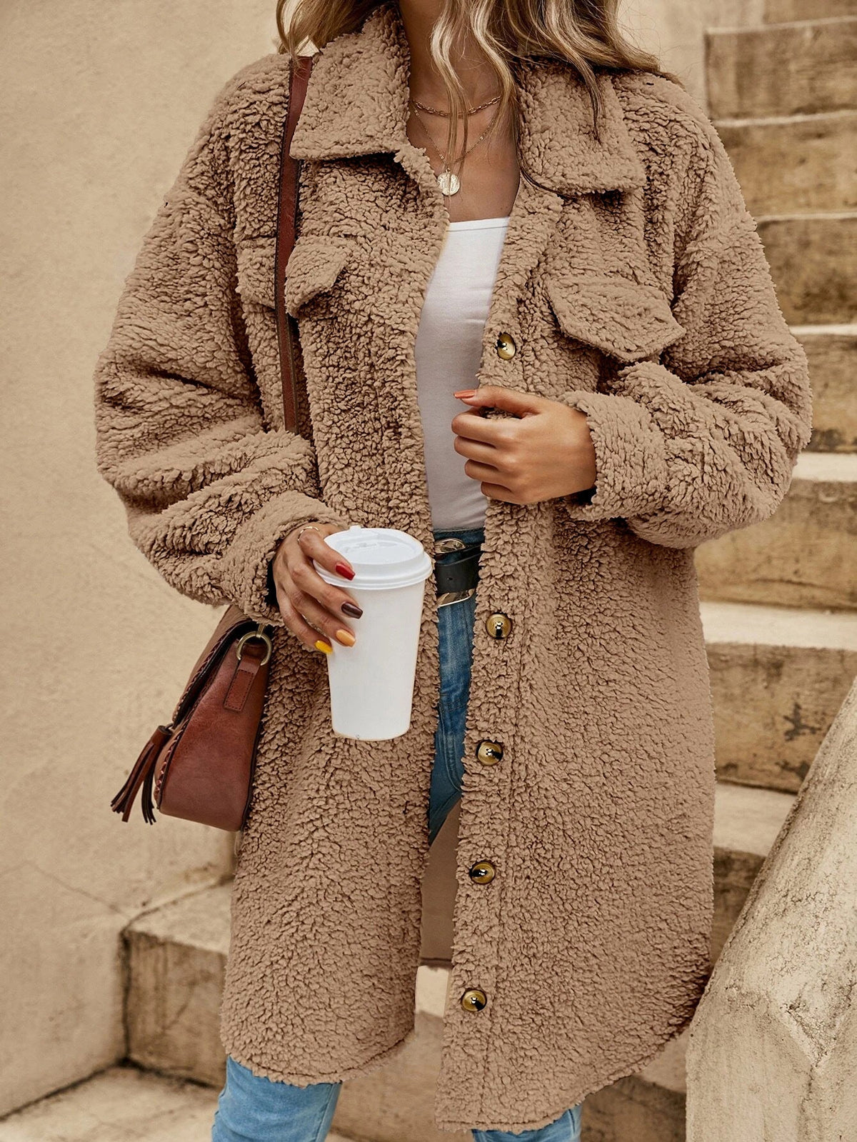Women's oversized plush fleece long coat with button-down closure and lapel collar for cozy winter style