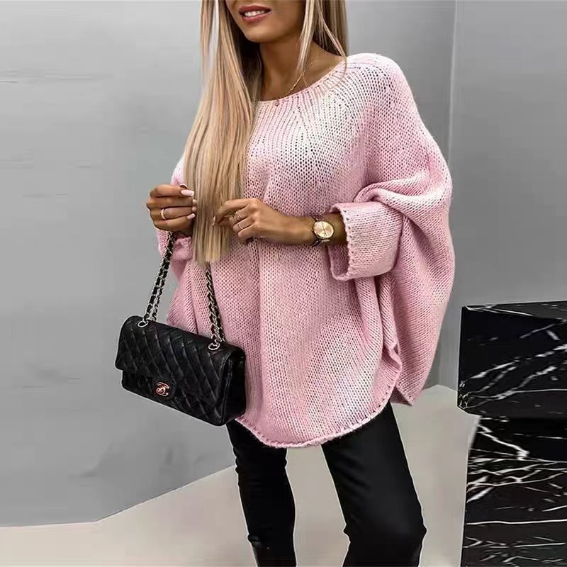 Women's cozy oversized loose knit winter sweater in neutral tones with relaxed drape silhouette