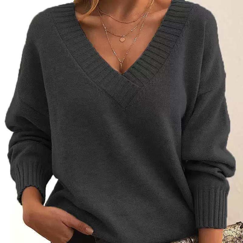Women's beige soft knit relaxed fit V-neck sweater with ribbed cuffs for cozy fall style