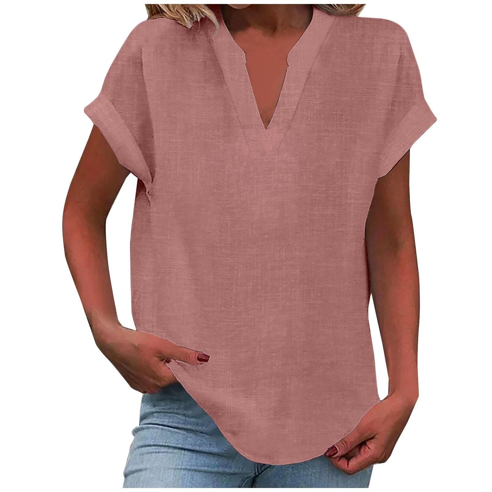 Relaxed white V-neck blouse with notched neckline, rolled short sleeves, and smooth draped fabric