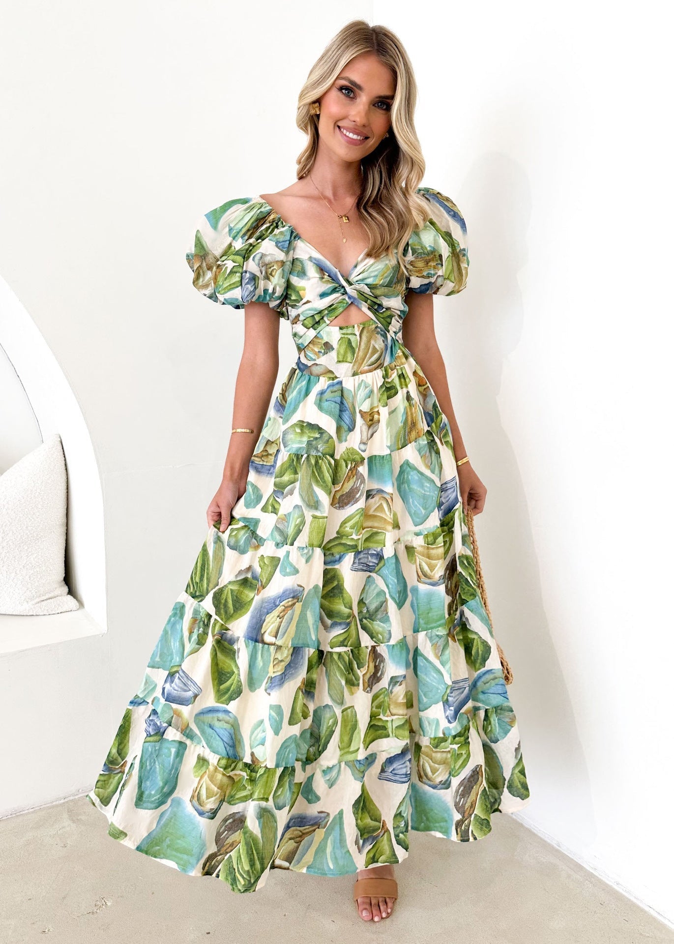 Women's printed maxi dress with off-shoulder neckline, puff sleeves, and smocked waist