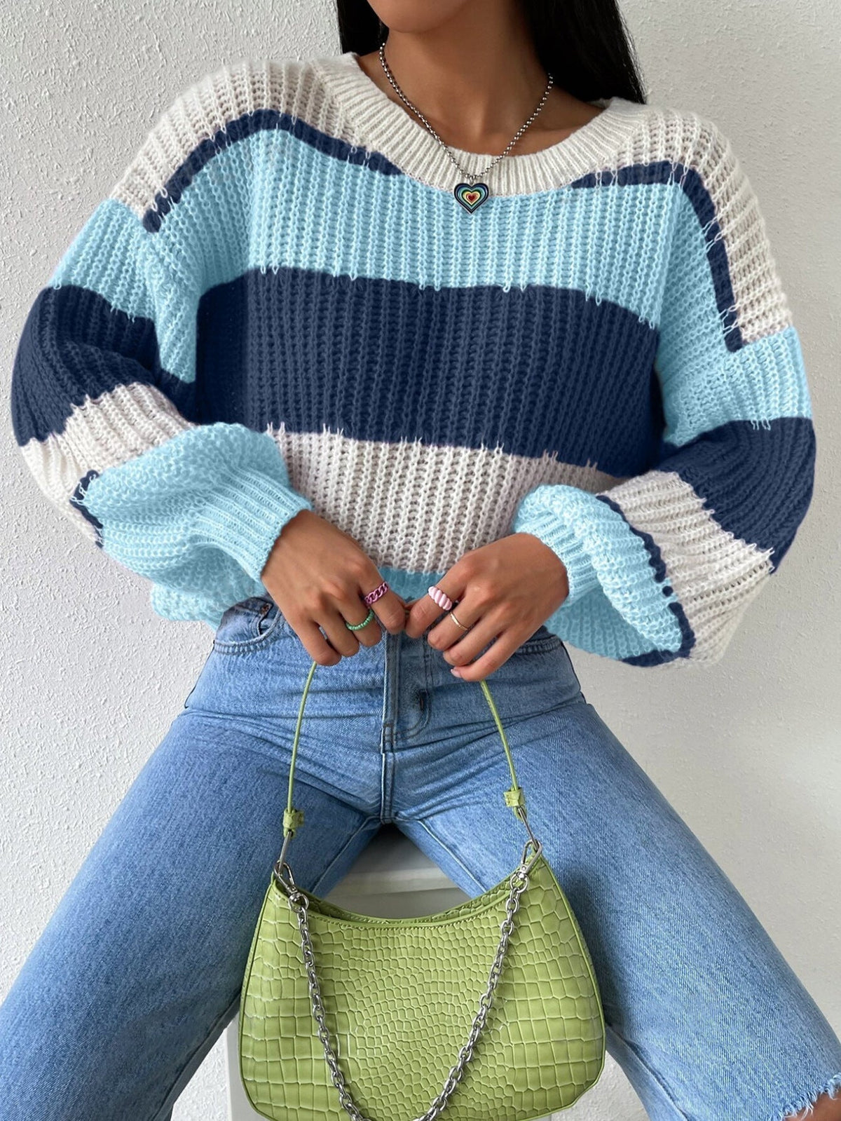 Women's striped knit pullover sweater in cozy soft fabric with classic timeless stripe pattern