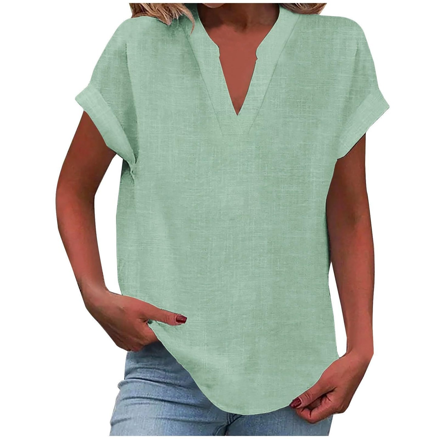 Relaxed white v-neck blouse with rolled short sleeves, smooth drape and polished everyday silhouette