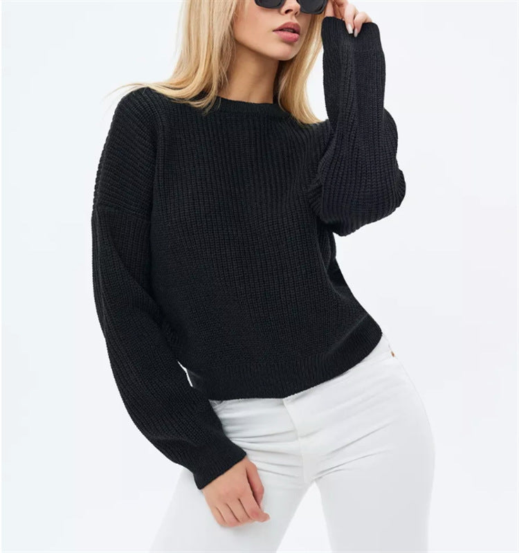 Oversized cream knit sweater with relaxed silhouette and plush soft-knit texture for effortless style