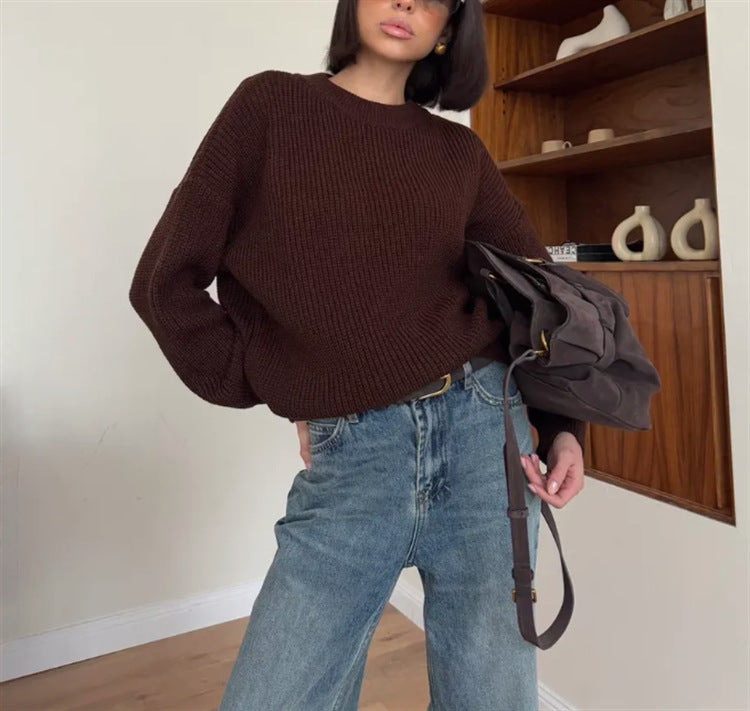 Oversized cream knit sweater with relaxed silhouette and plush soft-knit texture for effortless style