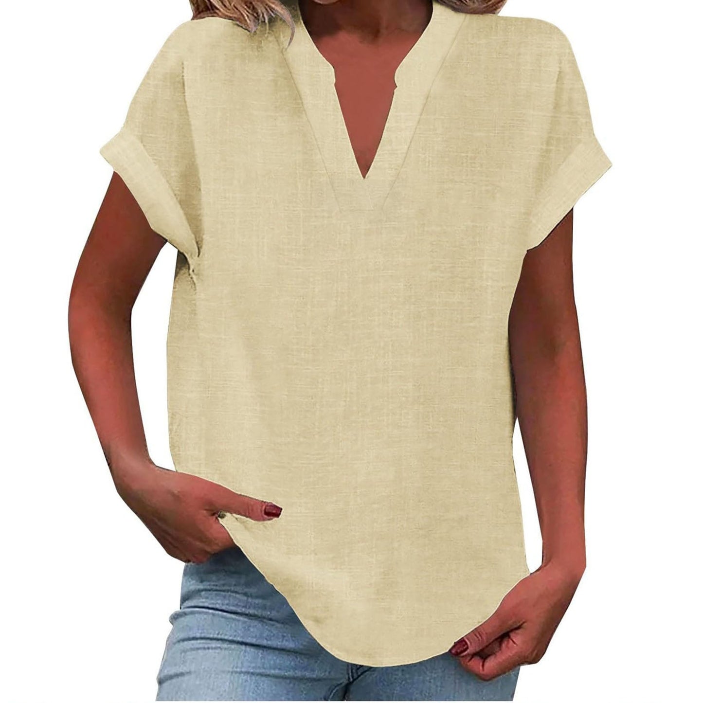 Relaxed white v-neck blouse with rolled short sleeves, smooth drape, and polished notched neckline