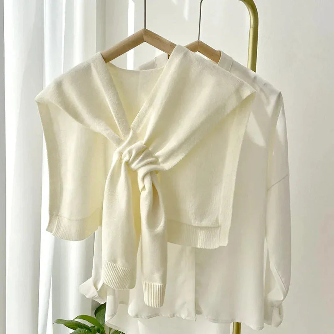Ivory preppy knit shawl with elegant tie-front drape, soft premium stretch fabric for effortless layering