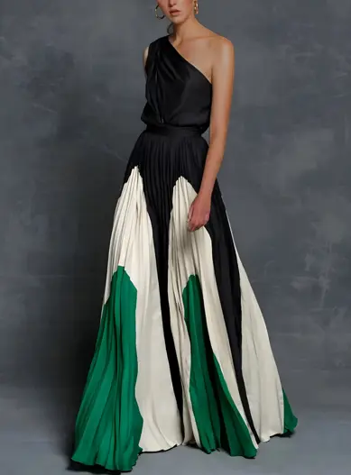 Elegant one-shoulder asymmetrical maxi dress in flowing pleated fabric with sculpted neckline