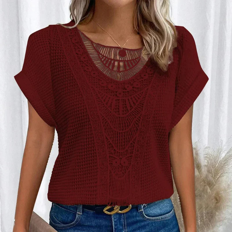 Soft feminine top with round neck, delicate lace trim, relaxed silhouette in elegant everyday style