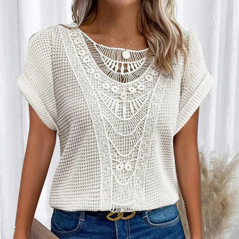 Soft feminine top with round neck, delicate lace trim, relaxed silhouette in elegant everyday style