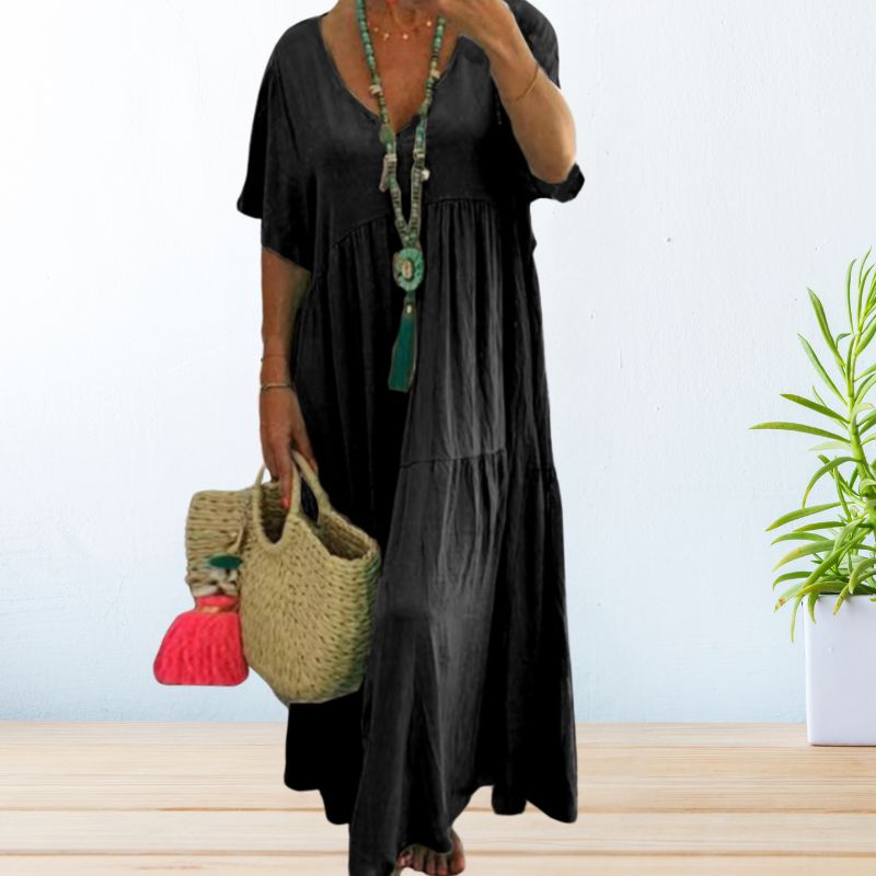 Women's draped elegant dress in soft natural tones with graceful silhouette and breathable relaxed fit