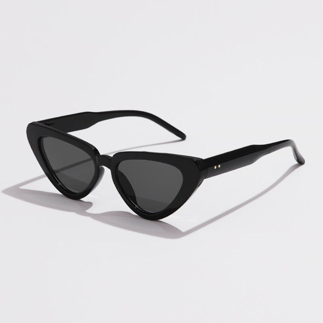 Black cat-eye sunglasses with sharp-edged frames, contemporary retro silhouette and UV400 protection