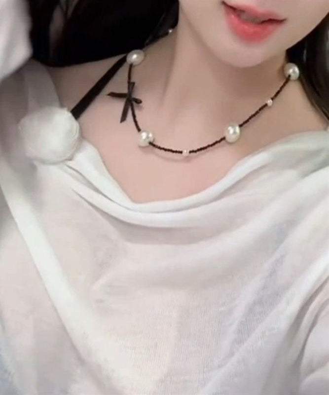 Collier original en acier inoxydable noir avec perles et nœud - Wavlynn