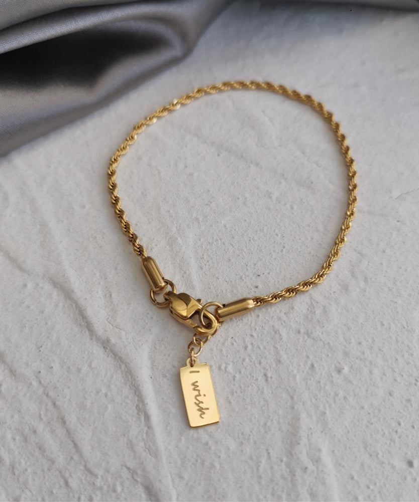 Bracelet à breloques torsadées en alliage de cuivre doré au design original avec pompons - Wavlynn