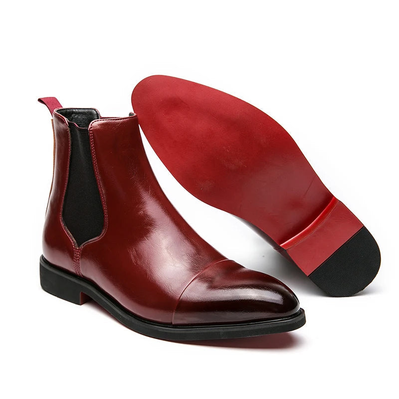 Black high-gloss leather Chelsea boots slip-on style with signature red rubber sole