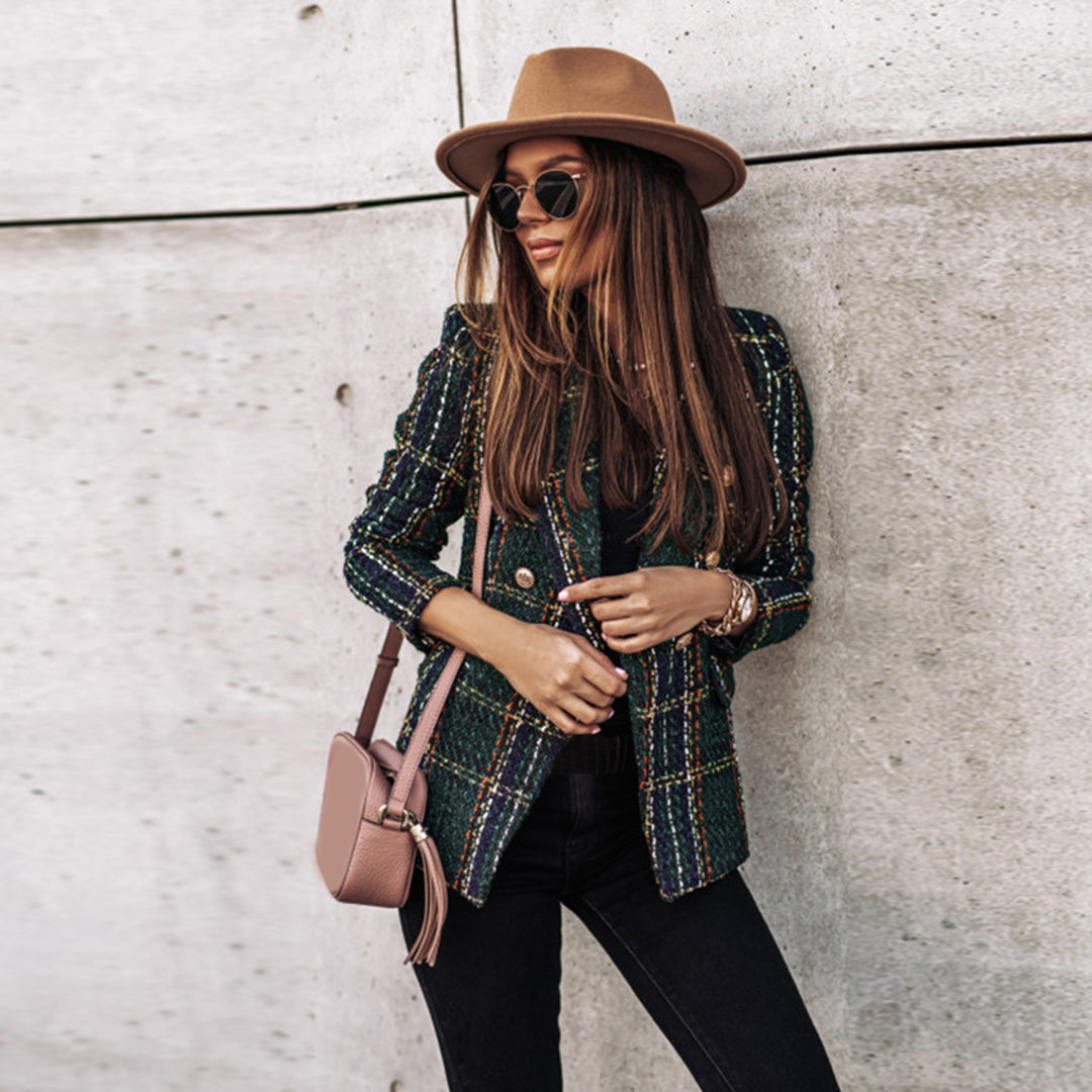 Women's classic tailored tweed blazer with rich texture and elegant gold button detailing