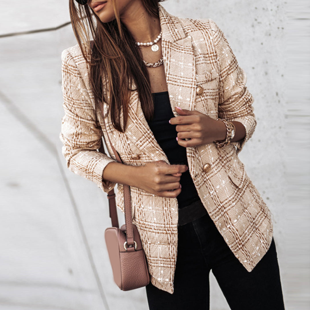 Women's classic tailored tweed blazer with rich textured fabric and elegant gold buttons