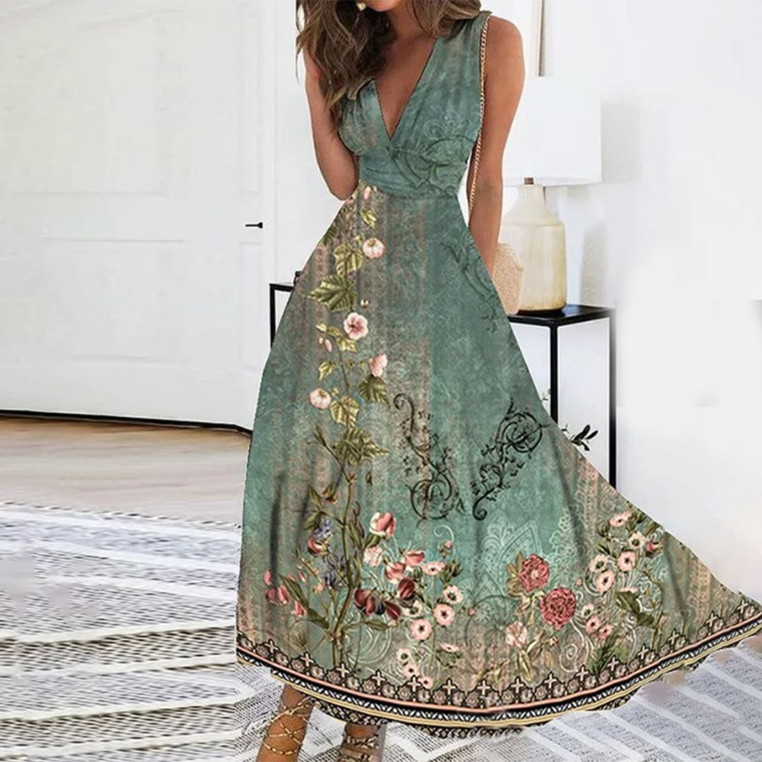 Women's sleeveless V-neck maxi dress in vibrant blue floral print with flowing full-length silhouette