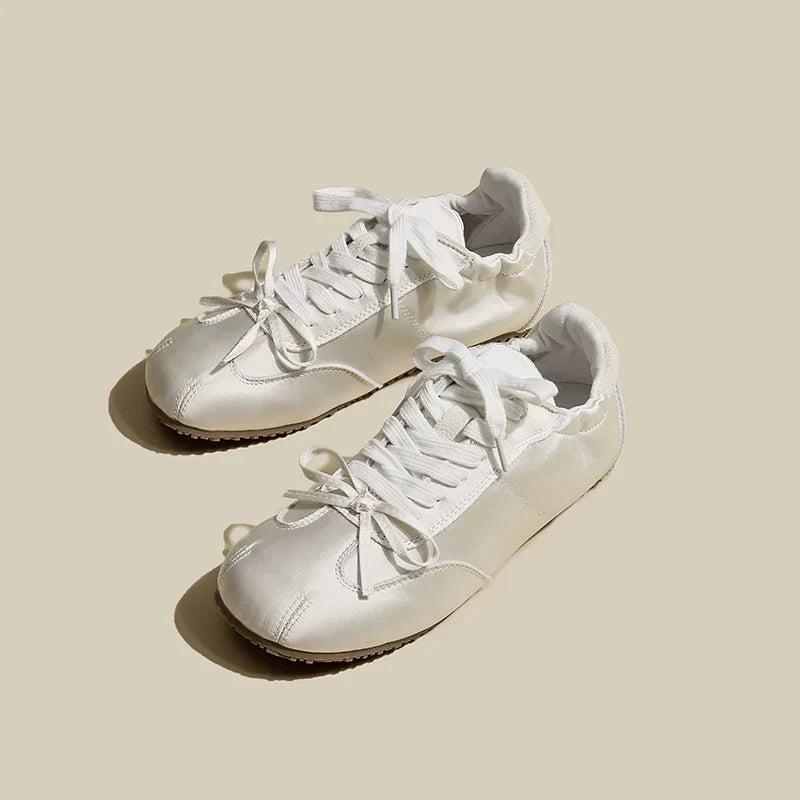 Caroline women's satin trainers in sleek finish with cushioned interior and lightweight sole