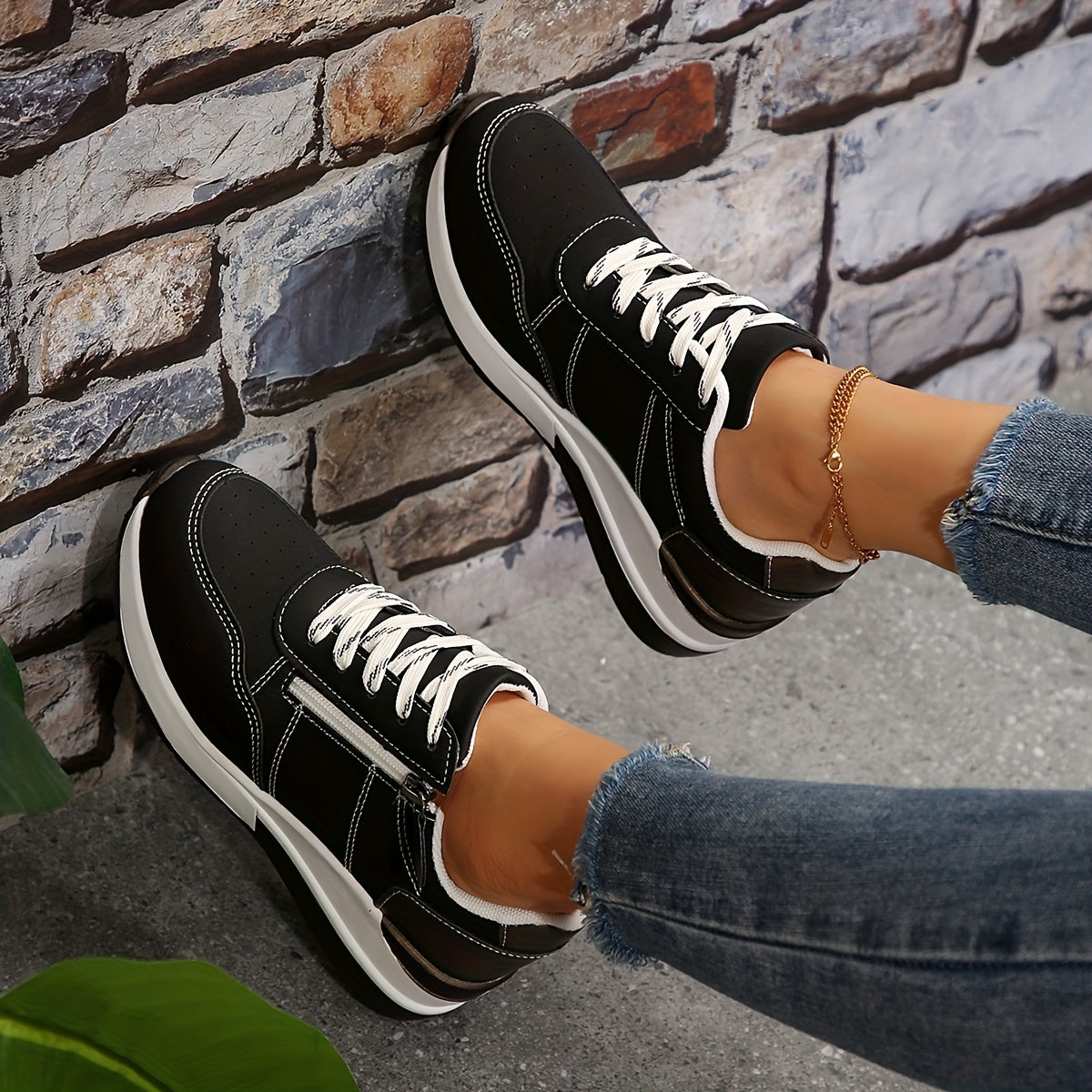 Women's white perforated low-top sneakers with lace-up closure and breathable mesh upper