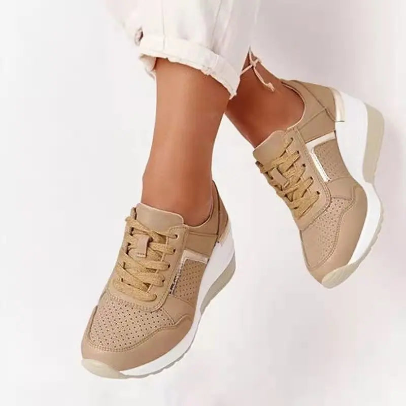 Women's white perforated wedge sneakers with hidden elevation sole for everyday comfort