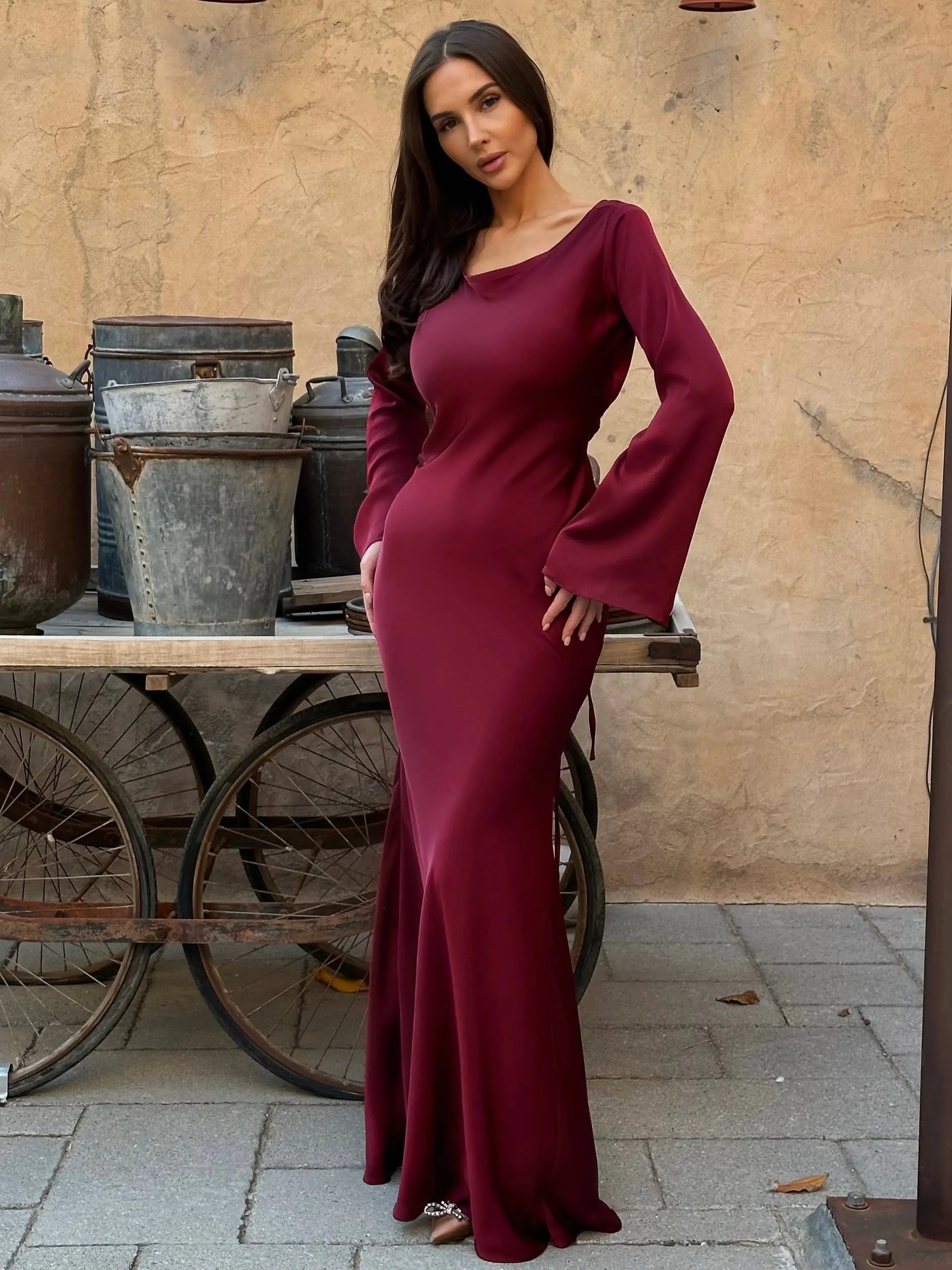 Women's ivory satin maxi dress formal gown with long draped sleeves and fluid floor-length silhouette