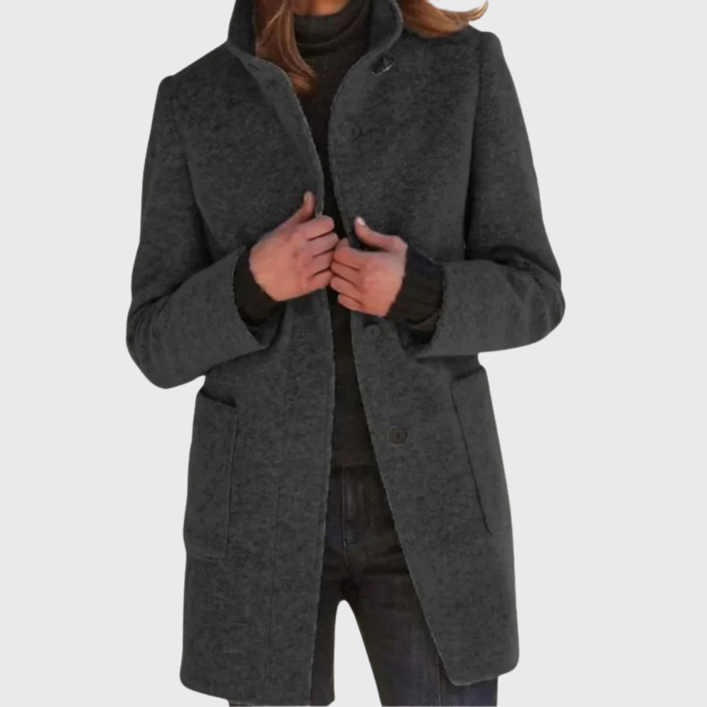 Beige tailored overcoat with streamlined silhouette and elongating flattering cut for polished style