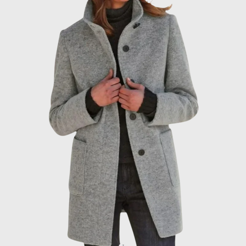 Beige tailored overcoat with streamlined silhouette and figure-flattering elongating cut