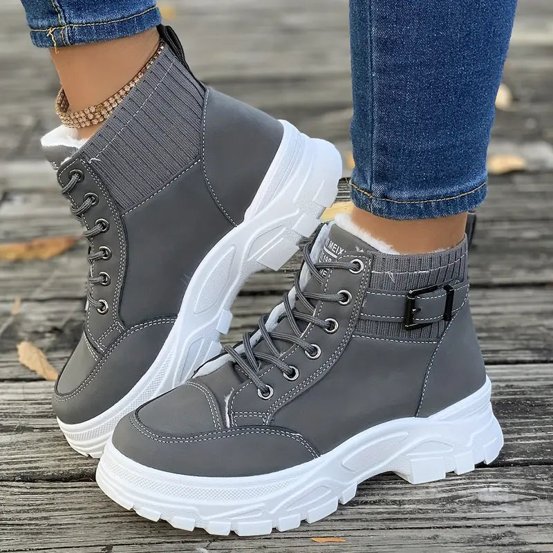 Women's black plush-lined ankle boots with chunky platform sole for cozy city-ready style
