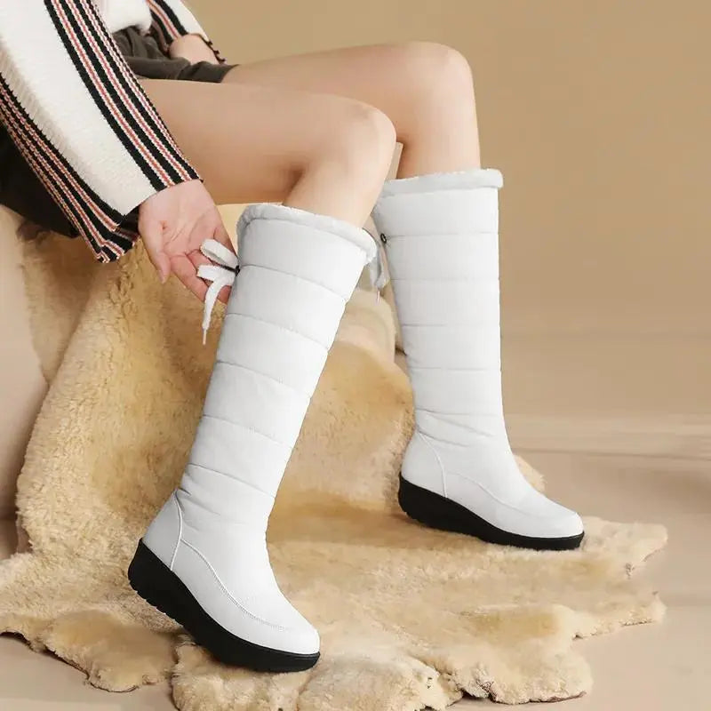 Women's brown plush lace-up winter boots with cozy fur lining and elegant ankle silhouette