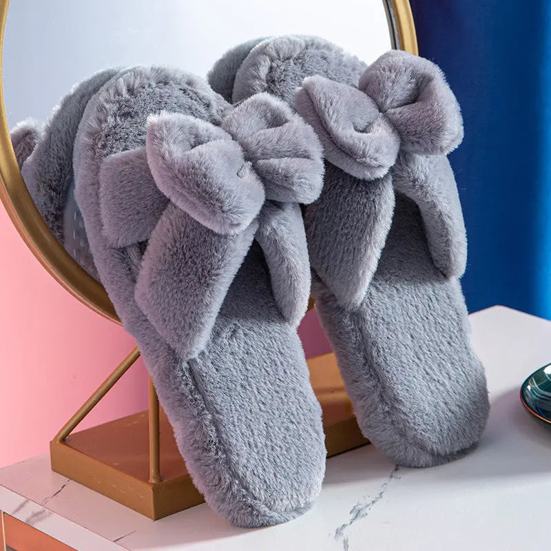 Women's blush pink plush bow slippers with faux fur lining and non-slip TPR sole