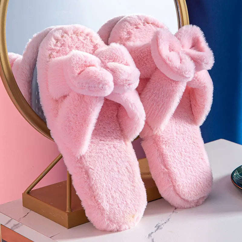 Women's plush faux fur slippers with bow detail, cozy slip-on style in neutral tone