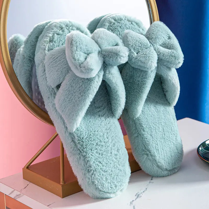 Women's plush faux fur slippers with bow detail, cozy slip-on style in neutral tones