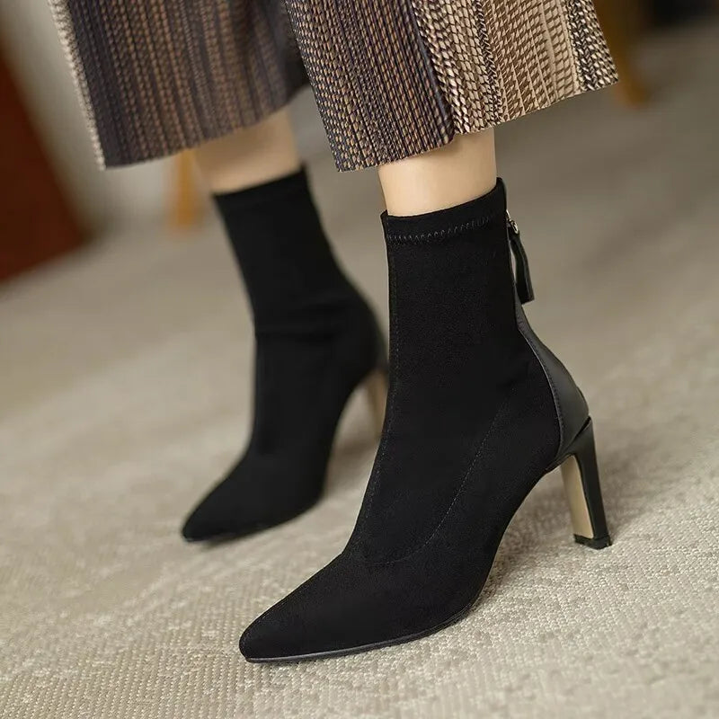 Women's black pointed toe stiletto ankle boots with slender heel, elegant autumn fashion