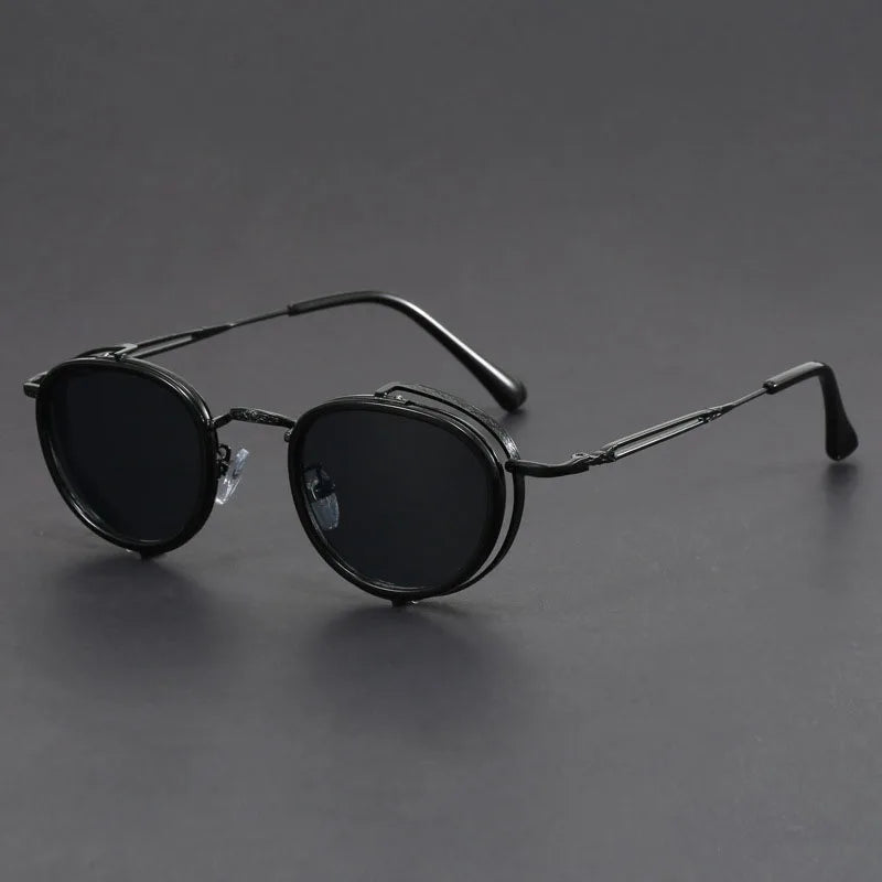 Porto Noir matte black round metal sunglasses with UV400 lenses and minimalist retro-industrial style