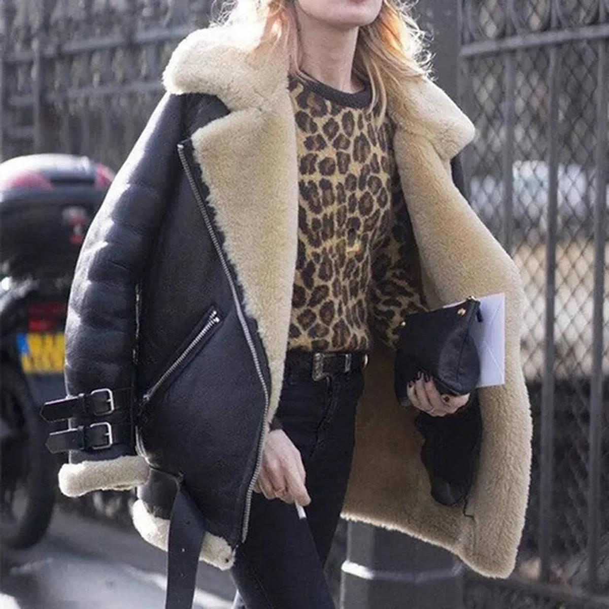 Women's black faux fur lined moto jacket with zipper buckle accents for urban winter warmth