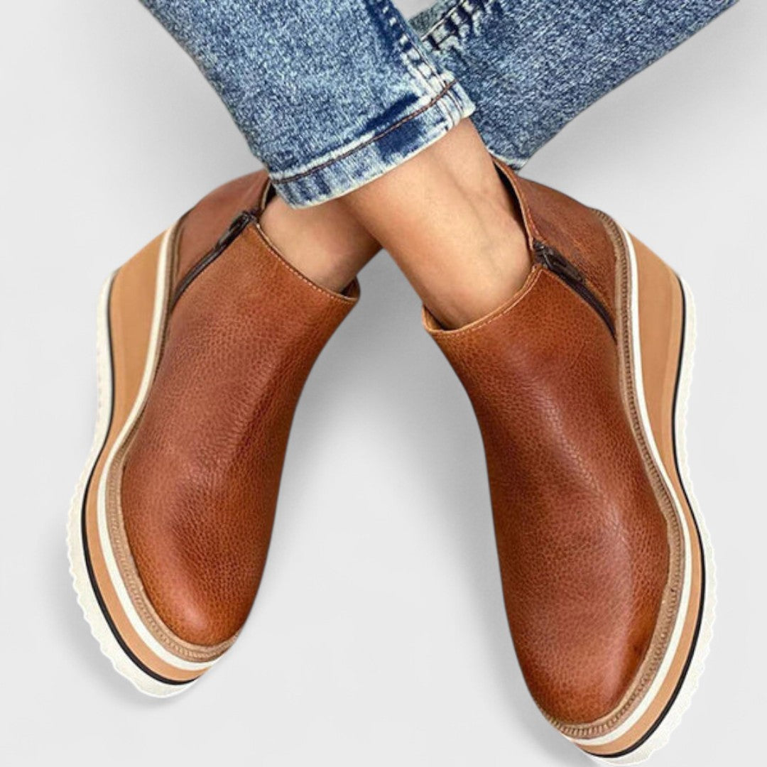 Elegant waterproof women's shoes in neutral tone with polished silhouette and weather-resistant sole