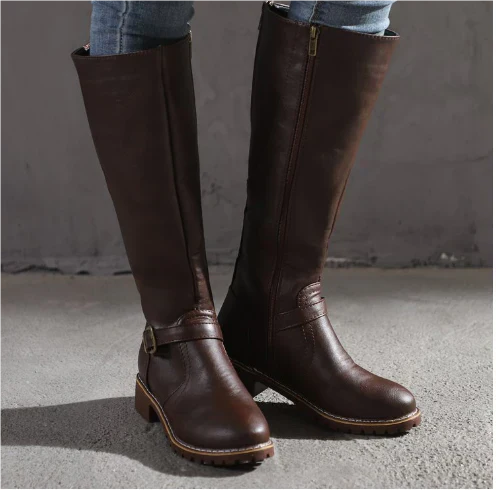 Women's black knee-high boots with sleek silhouette and leg-lengthening contoured design