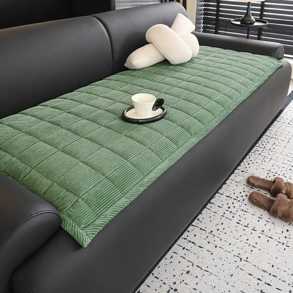 Quilted couch cover with non-slip backing in neutral tones, textured contemporary design for sofas