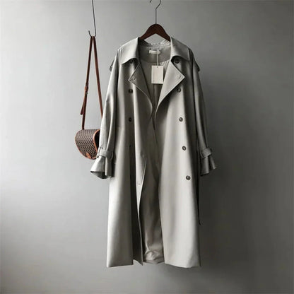 Rafaela beige double-breasted trench coat with adjustable belt, structured shoulders and flowing silhouette