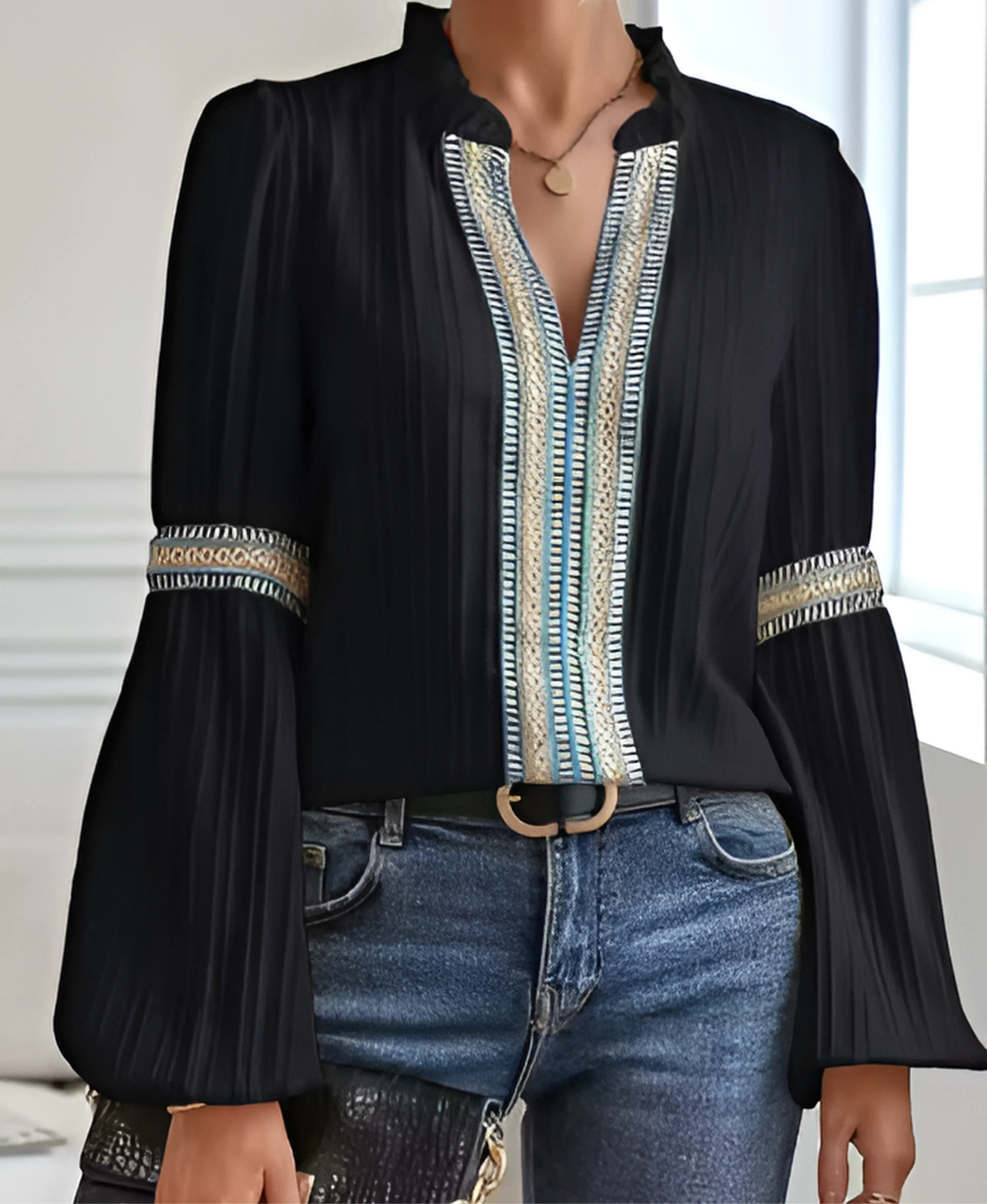 Vintage V-neck blouse with flowing fit, subtle embroidery, and flattering feminine neckline