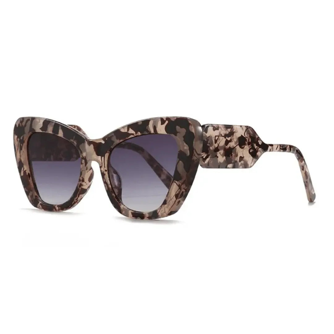 Retro cat-eye sunglasses with bold patterned temples, full-rimmed frames for a vintage-modern look