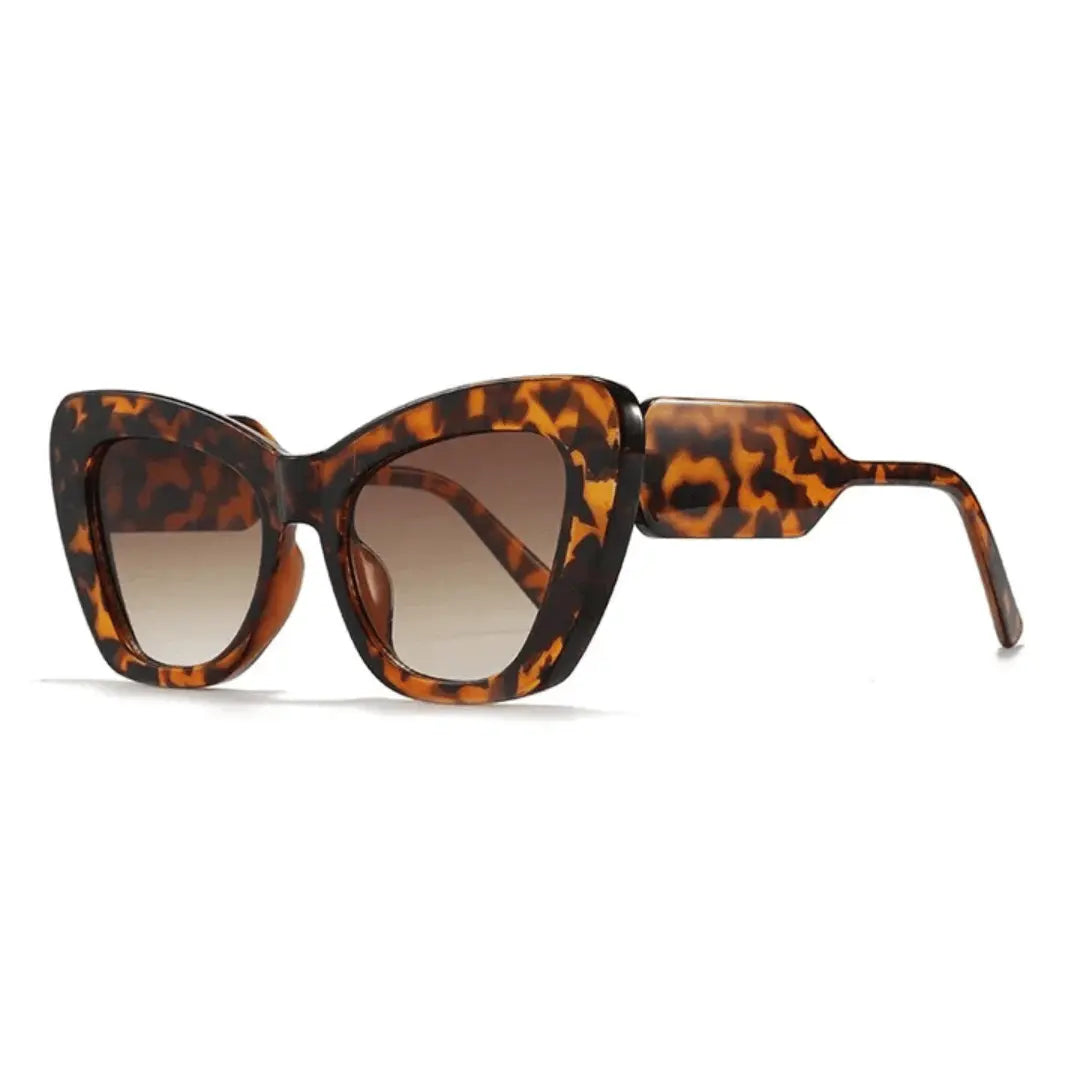 Retro cat-eye sunglasses with bold patterned temples, full-rimmed frames for a vintage-modern look