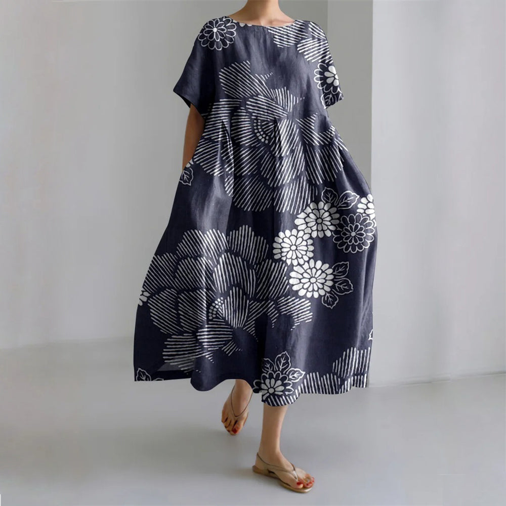 Floral silk-blend maxi gown with fluid draping in a vibrant garden-party print by Sofia Amoretti