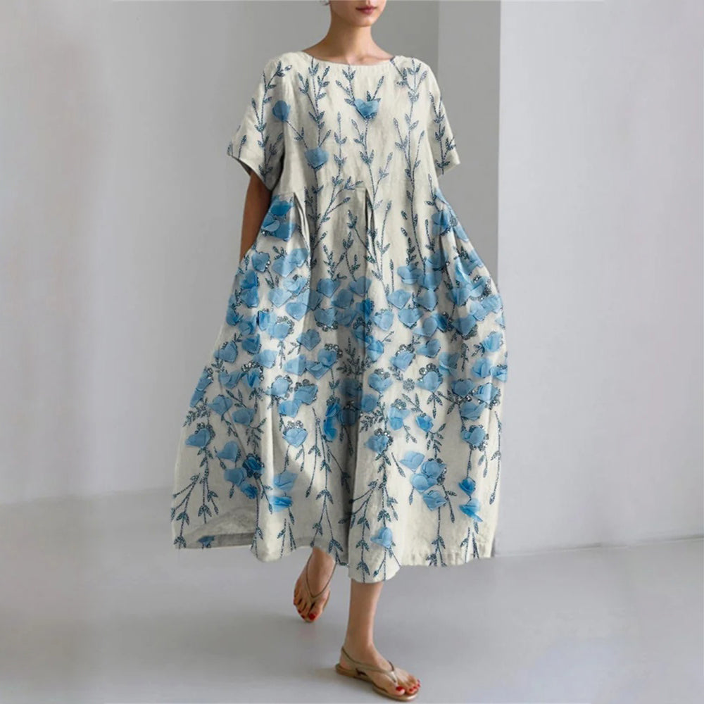 Floral silk blend maxi gown with elegant draping, multicolor botanical print, fluid silhouette for resort wear