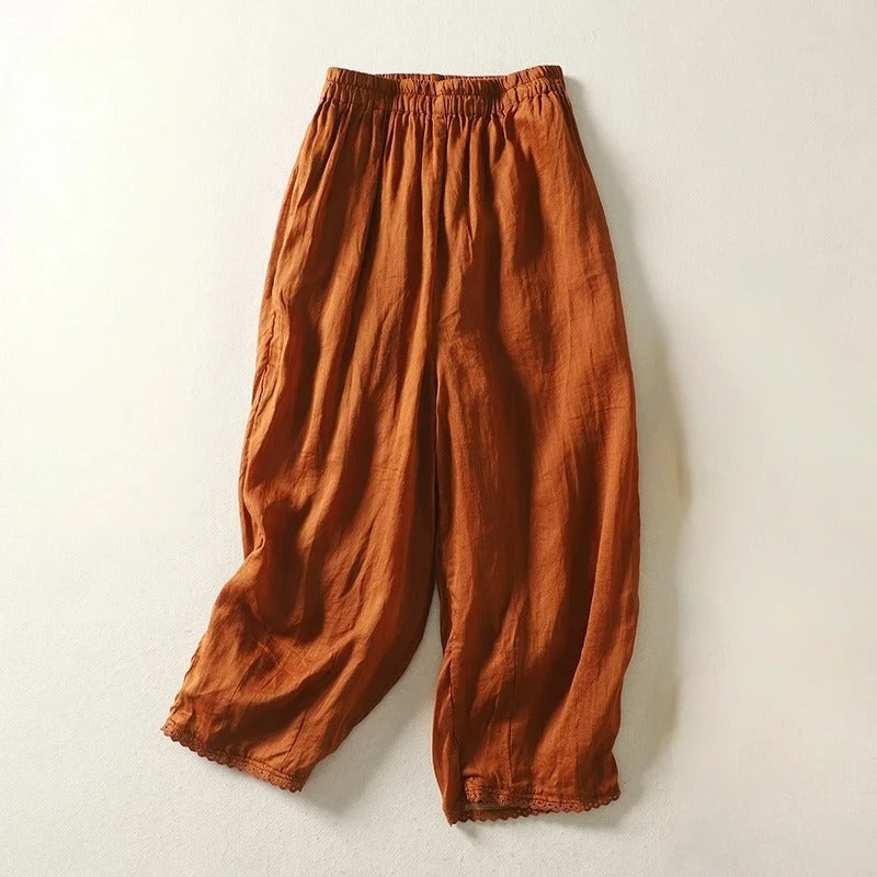 Rhea cropped linen trousers with relaxed fit, soft gathers, and stretch waistband in casual style